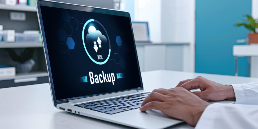 Dental Office Data Backup › TECHBLEED Laptop displaying cloud backup progress in a clinical setting