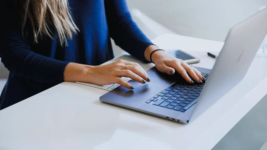 Office manager checking a payment email for red flags